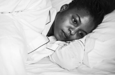 A woman wide awake in bed