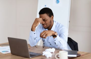 Exhausted african american manager suffering from burnout