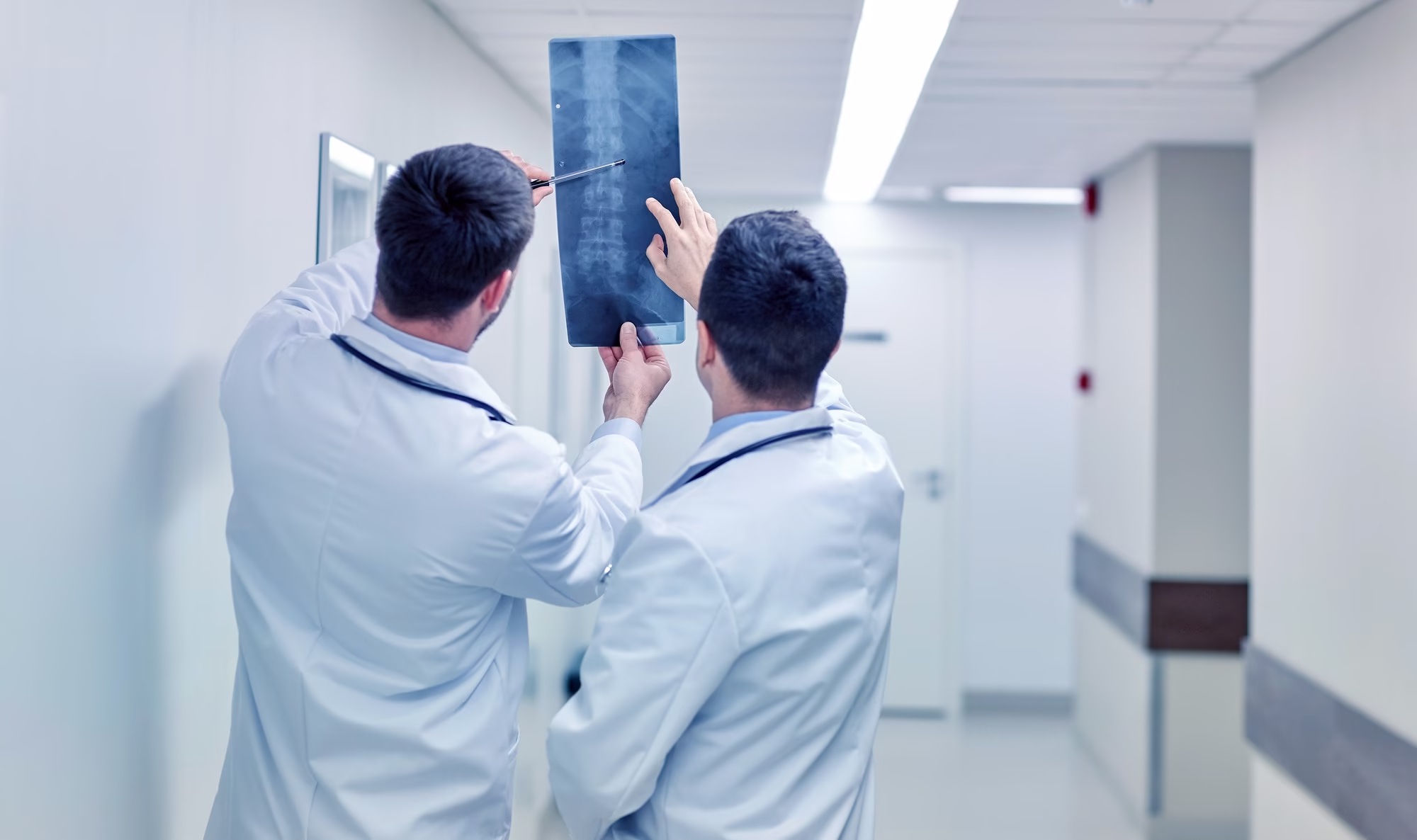 medics with spine x-ray scan at hospital